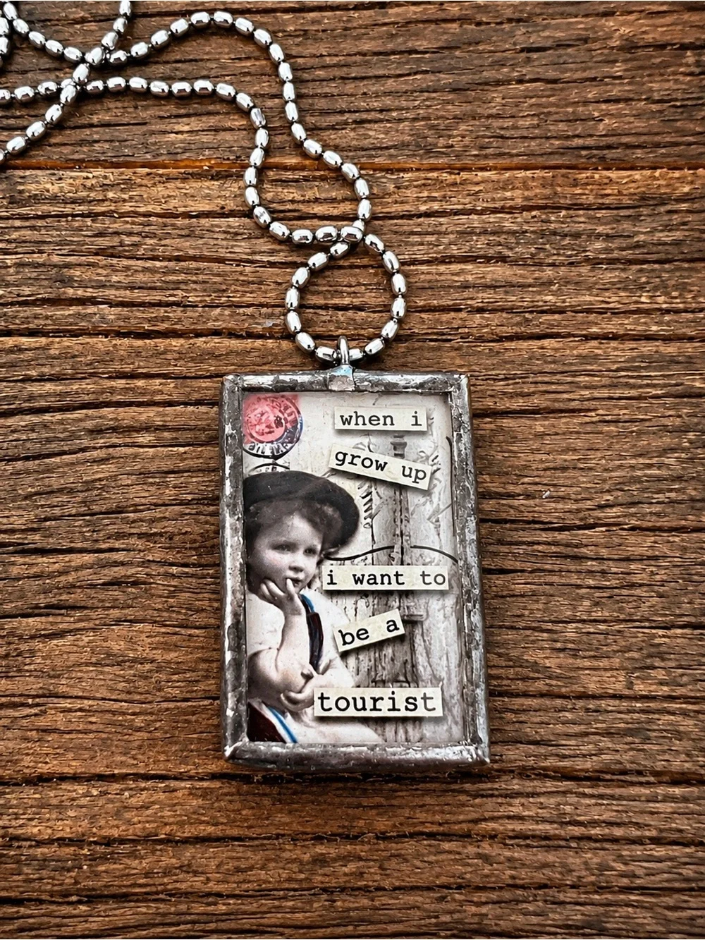 Vintage Style 'When I Grow Up I Want To Be A Tourist' Collage Pendant Necklace